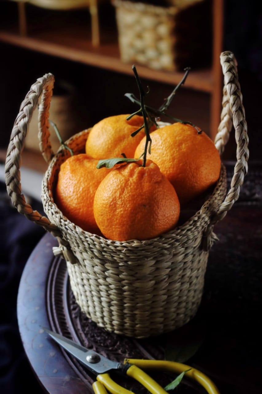 Tangerines inside a basket